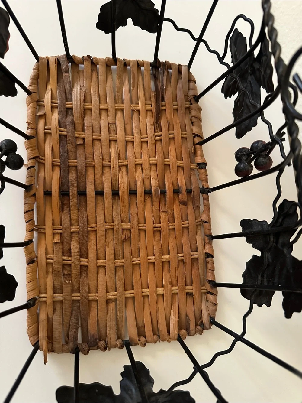 Black Metal and Brown Woven Decorative Basket with Green Leaf Accents